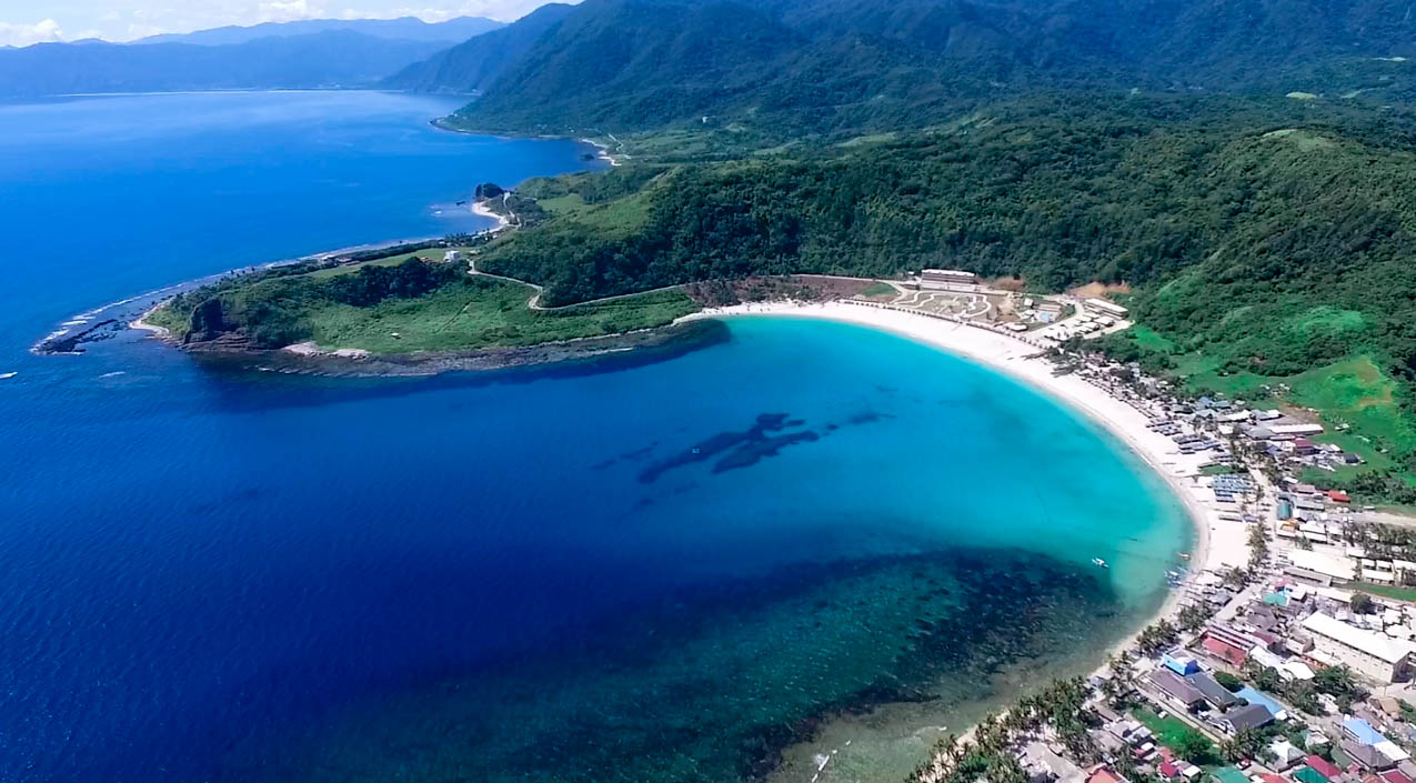 drone shot of the blue lagoon beach in pagudpud ilocos norte philippines